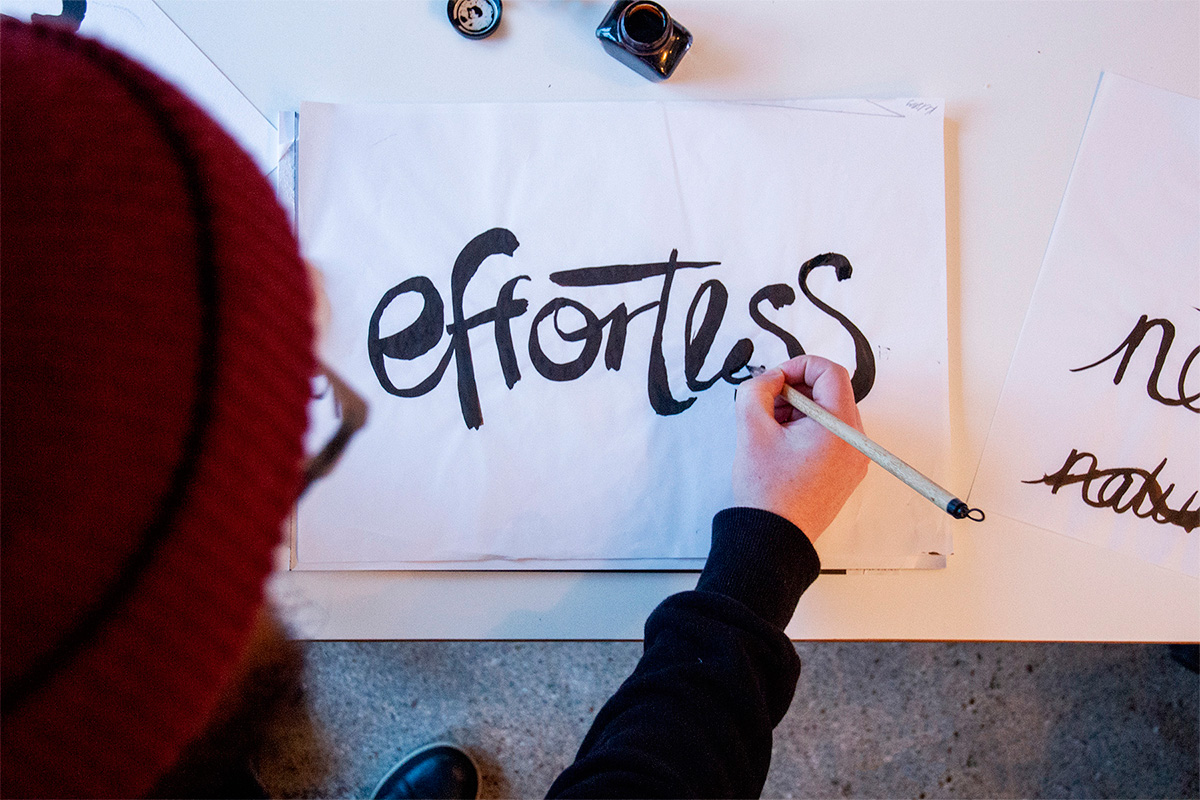 Leap's senior designer Nathan Lance creating hand-drawn typography for a client