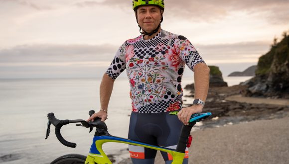 matt standing next to his bike preparing for ride the change to cop26