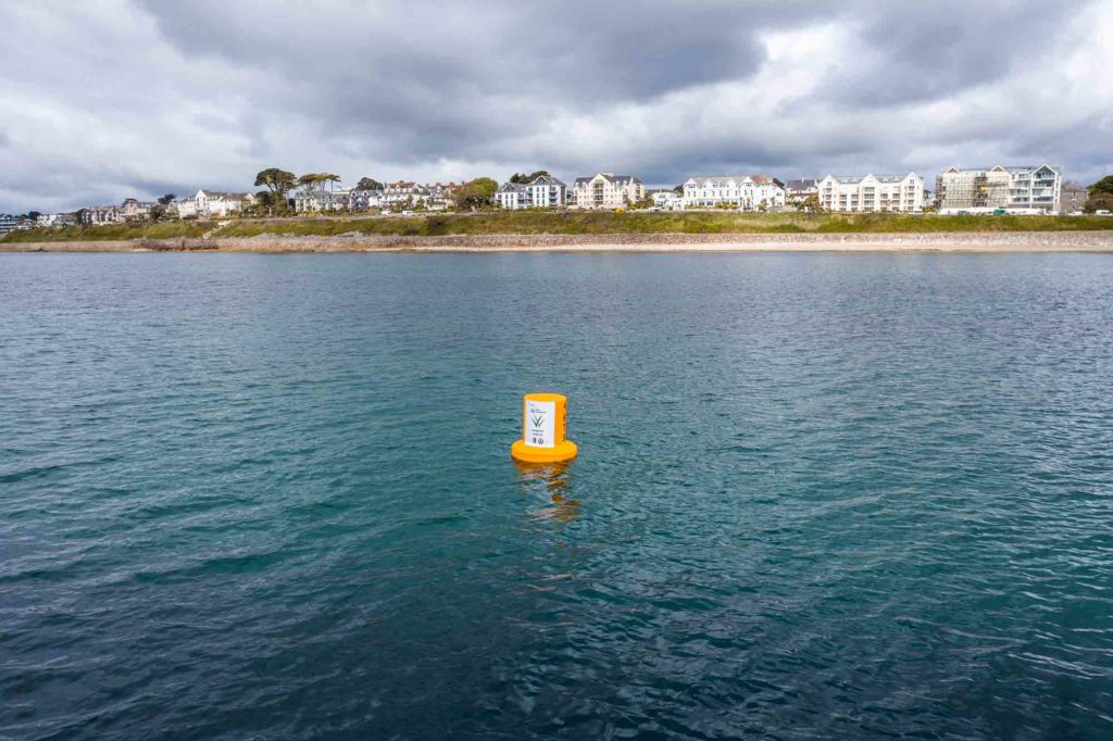 marker buoy showing location of seagrass meadow restoration in falmouth off castle beach